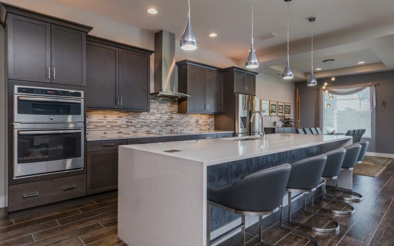 Contemporary kitchen with grey wood custom cabinets