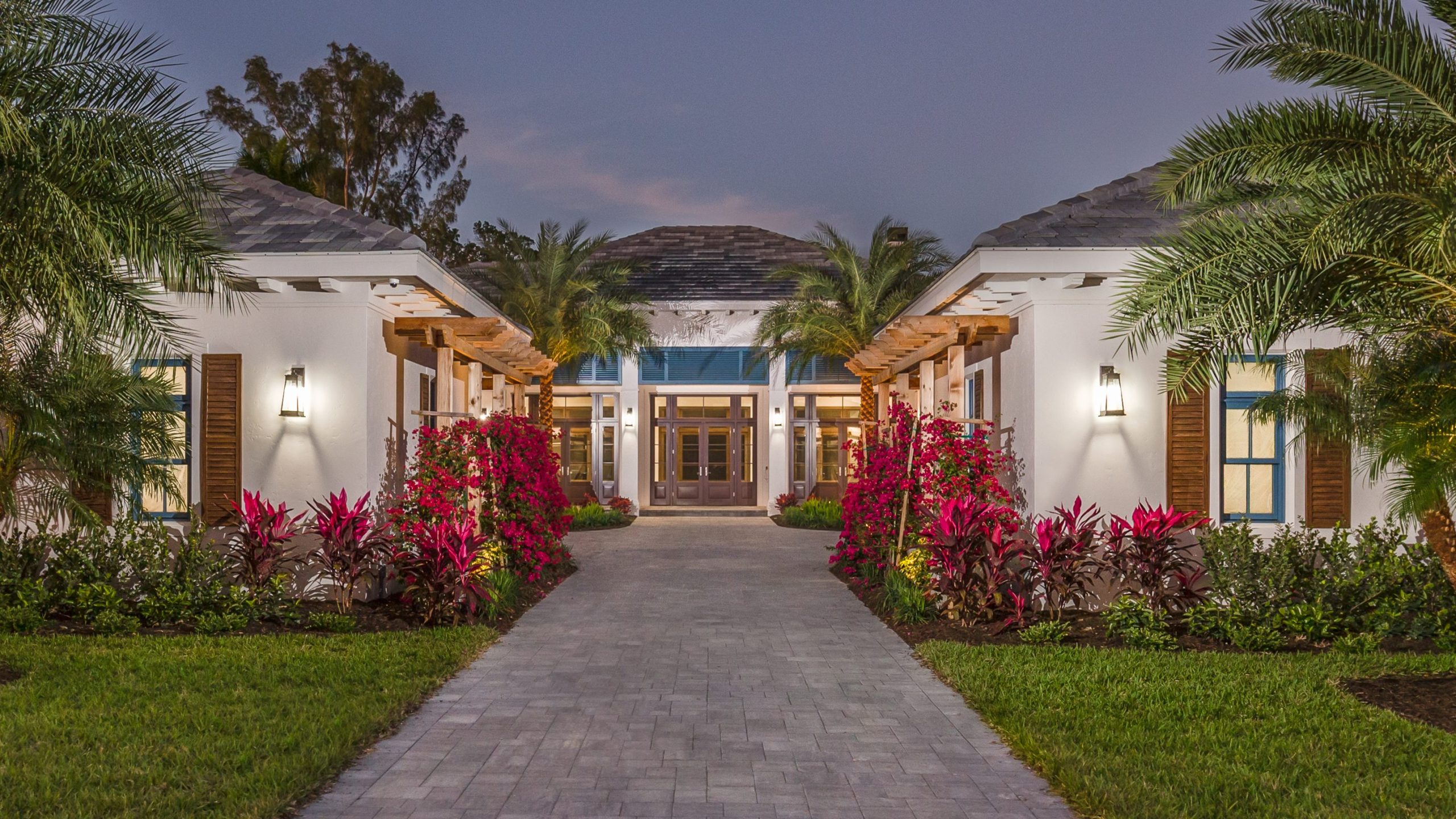 Exterior of a West-Indies inspired custom home built by Aubuchon Homes in the Carleton neighborhood in Fort Myers, FL.