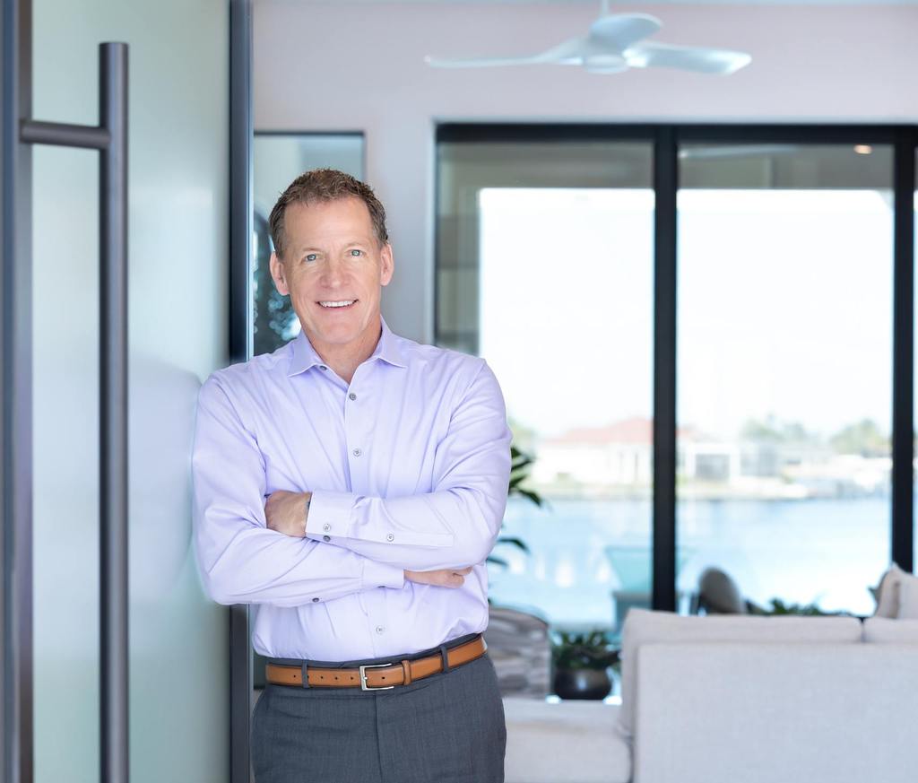 Gary Aubuchon stands in the doorway of a custom home.