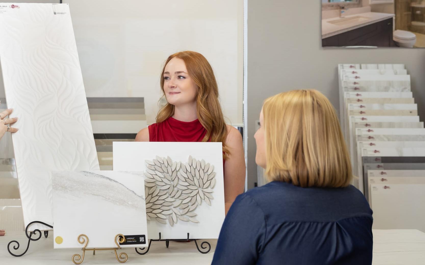 Design center team members show selection options to a client